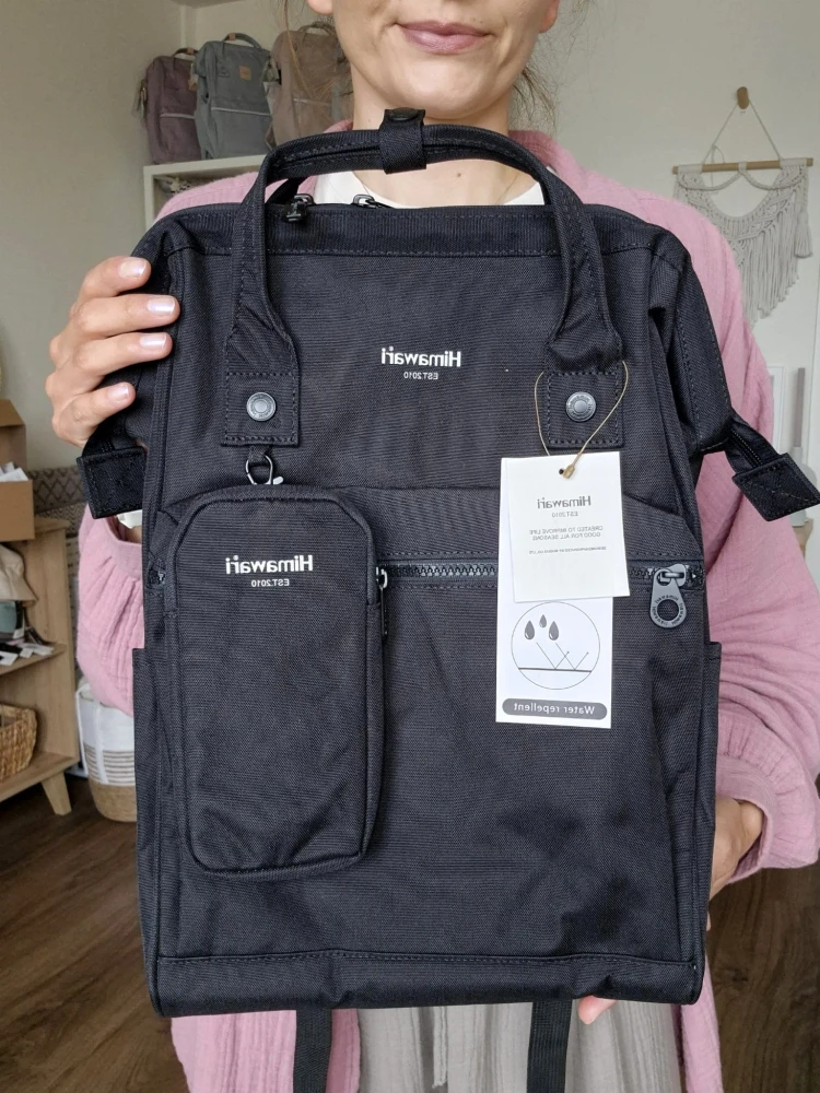 Wodoodporny plecak miejski unisex z uchwytem na walizkę - na podróż, do pracy, na wycieczkę, na uczelnię i do szkoły/ Kolor czarny