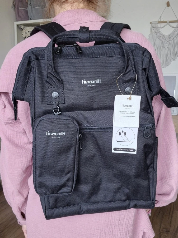 Wodoodporny plecak miejski unisex z uchwytem na walizkę - na podróż, do pracy, na wycieczkę, na uczelnię i do szkoły/ Kolor czarny