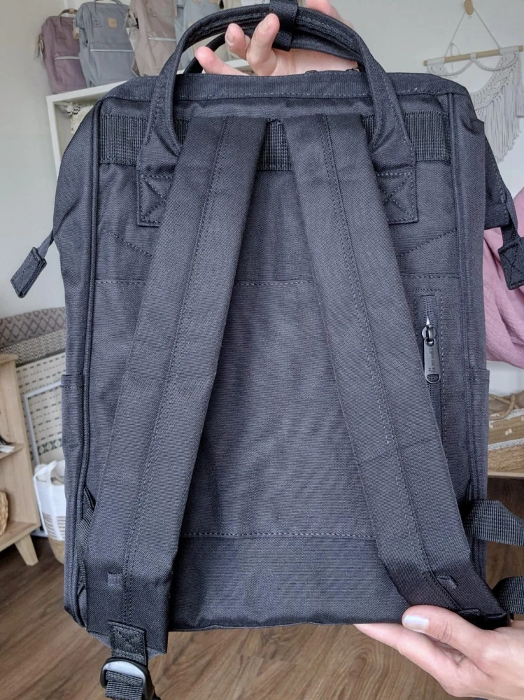 Wodoodporny plecak miejski unisex z uchwytem na walizkę - na podróż, do pracy, na wycieczkę, na uczelnię i do szkoły/ Kolor czarny