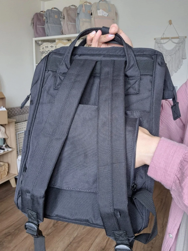 Wodoodporny plecak miejski unisex z uchwytem na walizkę - na podróż, do pracy, na wycieczkę, na uczelnię i do szkoły/ Kolor czarny